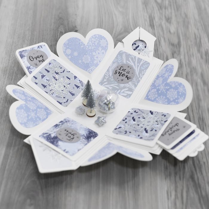 Eksplosjonseske dekorert med designpapir og vinterlandskap