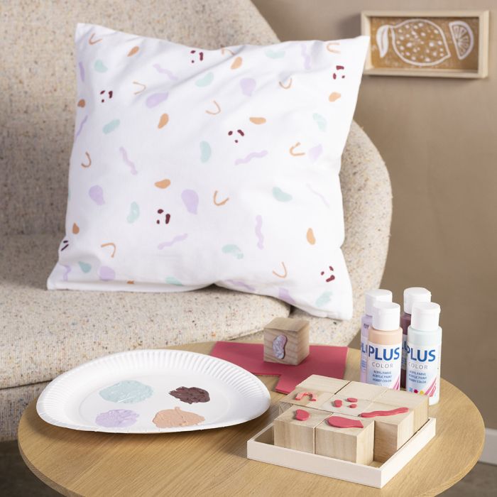 Tekstiltrykk med lag-selv-stempler